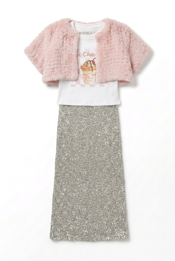Outfit flat lay with a baby tee, cropped pink bolero, and silver sequin maxi skirt